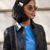 Mariam Mohammad wears a Miu Miu jacket, dress, sunglasses and hair clips outside the Miu Miu show during Womenswear Spring/Summer 2025 as part of...