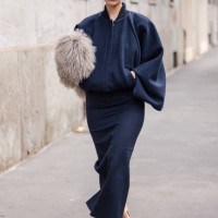 Marie Gaguech wears blue bomber jacket, blue pencil maxi skirt, taupe fur pouch bag, cream mary jane heels, outside Max Mara, during the Milan...