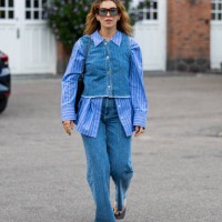 Masha Sedgwick wears striped button shirt, jeans, top outside Baum & Pferdgarten during day three of the Copenhagen Fashion Week SS25 on August 07,...