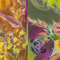 mass produced colored textile in a traditional east market in malaysia - garden decoration stock-fotos und bilder