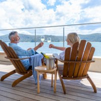 mature couple drinking wine out on the deck. - travel stock pictures, royalty-free photos & images