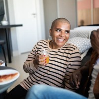 mature couple eating pizza at home - junk food stock pictures, royalty-free photos & images