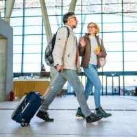 mature couple of passengers at the train station - travel stock pictures, royalty-free photos & images