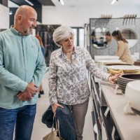 mature couple shopping for bathroom equipment - home decoration stock pictures, royalty-free photos & images