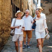 mature friends looking around old town italy - travel stock pictures, royalty-free photos & images