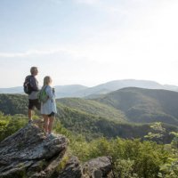 mature hiking couple relax at viewpoint - travel stock pictures, royalty-free photos & images