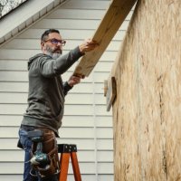 mature man building shed in back yard - home decoration stock pictures, royalty-free photos & images