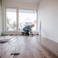 mature man fitting flooring in new home - home decoration stock pictures, royalty-free photos & images