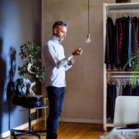 mature man getting ready for work - fashion stock-fotos und bilder