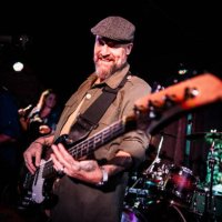 mature man playing guitar during show at night club - concert stock pictures, royalty-free photos & images