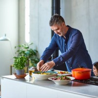 mature man preparing healthy meal on kitchen counter - food stock pictures, royalty-free photos & images