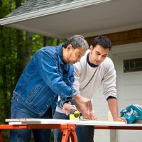 mature man working with son - home decoration stock pictures, royalty-free photos & images
