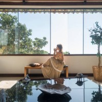 mature woman drinking by hotel window - fashion stock pictures, royalty-free photos & images