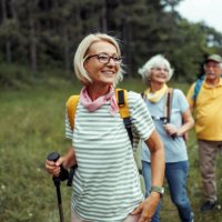 mature woman enjoying her day in forest with friends - travel stock pictures, royalty-free photos & images