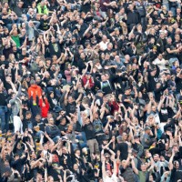 May 2024, Bavaria, Munich: Fans watch the concert by US metal band Metallica in the Olympic Stadium. The band is performing as part of their 