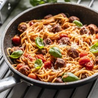 meatballs with spaghettis tomato sauce in a pan. italian pasta with beef balls in tomato sauce, parmesan and basil. - food stock pictures, royalty-free photos & images