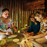 medium shot of women learning how to make tortillas during traditional mayan cooking class - food stock pictures, royalty-free photos & images