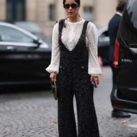 Mehrnaz Ansari is seen outside Chanel show wearing black Chanel sunnies, pearl earrings, white lace top with long sleeves, black Chanel tweed...