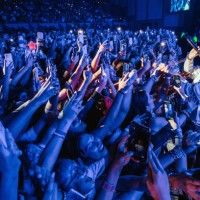 Member of Latin Mafia band performs with the crowd during a concert at Auditorio Citibanamex on September 10, 2023 in Monterrey, Mexico.