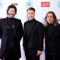 Members of Take That Howard Donald, Gary Barlow and Mark Owen backstage at the Coronation Concert held in the grounds of Windsor Castle on May 7,...
