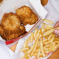 men eating fast food, fries chicken and fries - junk food stock pictures, royalty-free photos & images