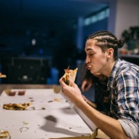 men enjoying pizza - junk food stock pictures, royalty-free photos & images