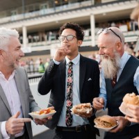 men having fun over a burger and chips - junk food stock pictures, royalty-free photos & images