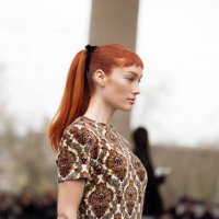 Meredith Duxbury wears a colourful dress with ornaments and tassels outside Rabanne during the Womenswear Fall/Winter 2024/2025 as part of Paris...