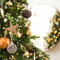 merry christmas tree with many different decorations and festive lights near mirror. new year celebration concept. beautiful backdrop for your design - home decoration stock pictures, royalty-free photos & images