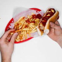 messy eating, hot dog and fries, overhead view - junk food stock pictures, royalty-free photos & images
