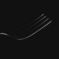 metal fork on black background - food stock pictures, royalty-free photos & images