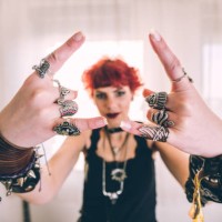 metal girl showing devil horns gesture - fashion stock pictures, royalty-free photos & images