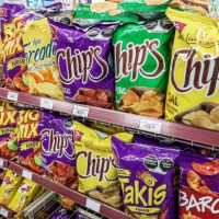 Mexico City, Mexico, Avenida Paseo de la Reforma, Oxxo snacks and chips display .