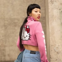 Michelle Song is seen on the street during Paris Fashion Week SS19 wearing Hello Kitty crop sweater and torn denim on October 2, 2018 in Paris,...