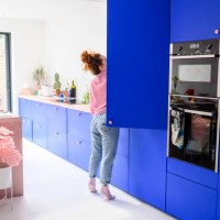 mid adult caucasian woman reaching into refrigerator - home decoration stock pictures, royalty-free photos & images