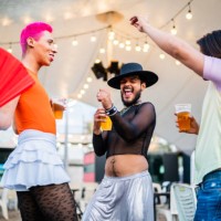 mid adult friends dancing on a gay festival - concert stock pictures, royalty-free photos & images