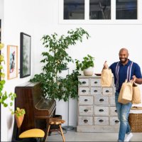 mid adult man bringing takeaway food back home - junk food stock pictures, royalty-free photos & images