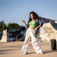 mid adult woman dancing reggaeton at skateboard park - fashion stock pictures, royalty-free photos & images