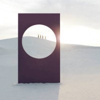 mid distance view of female models walking at white desert seen through window frame - fashion stock-fotos und bilder