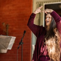 middle age woman singing with sign language outdoors - concert stock pictures, royalty-free photos & images