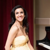 middle eastern woman smiling at piano - concert stock pictures, royalty-free photos & images