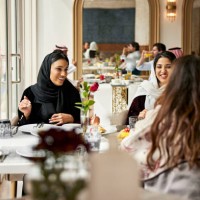 middle eastern women enjoying meal in hotel restaurant - food stock pictures, royalty-free photos & images
