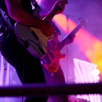 midsection of performance musician playing guitar in rock music concert - concert stock pictures, royalty-free photos & images