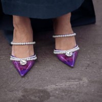 Miki Cheung seen wearing a pink Valentino belt and a matching pink bag by Valentino, Chanel shades and earrings by Chanel, a long skirt and purple...