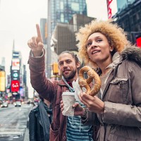mixed race couple visiting times square new york in autumn. - food stock pictures, royalty-free photos & images