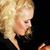 Model checks her cell phone backstage at the Zang Toi Fall 2007 fashion show during Mercedes-Benz fashion Week in The Showroom in Bryant Park...