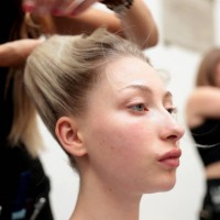 Model gets their hair styled backstage ahead of the A Journey Towards Marvel Hill: SS25 By Genaro Rivas show during London Fashion Week September...