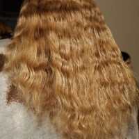Model, hair detail is posing backstage at the Federico Cina fashion show during the Milan Menswear Fall/Winter 2024-2025 on January 13, 2024 in...