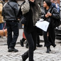 Model Houjing Cui is seen wearing a green jacket, black pants, black scarf and black sunglasses outside the Ashlyn show during NYFW F/W 2025 on...