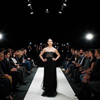model in gown walking down catwalk - fashion stock pictures, royalty-free photos & images